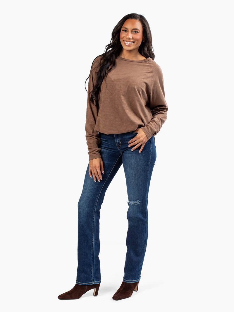 Tall woman wearing brown malley long sleeve tee
