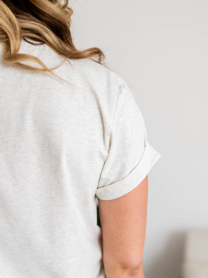 Close-up of grey cuffed short sleeve on Frame Tee for tall women