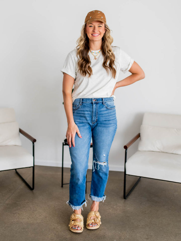 Front view of frame tee in marled grey on tall model