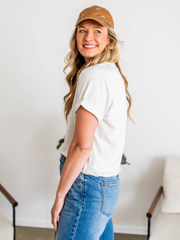 Side profile of tall model wearing grey-colored frame tee