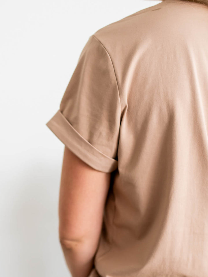 Close-up of cuffed short sleeve on Frame Tee for tall women in latte color