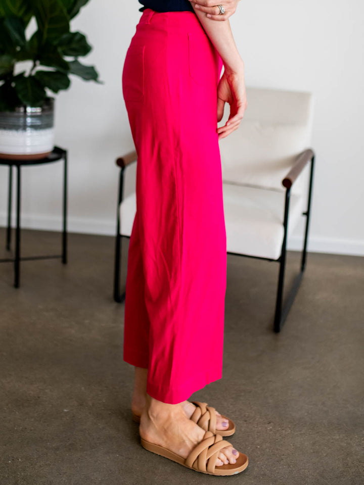 Side view of breathable summer cropped pants for tall women in bold pink color