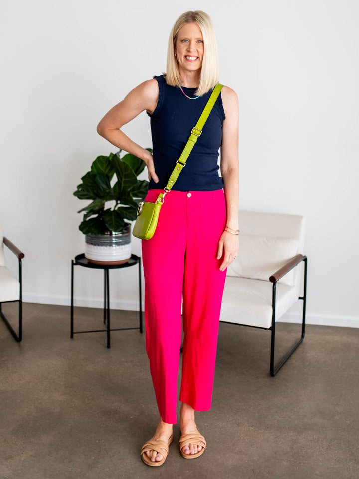 Tall woman wearing bright pink cropped pants with proper ankle length