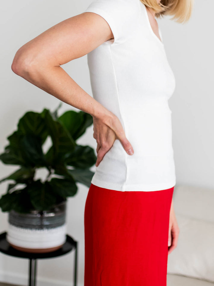 Side view of white square neck ribbed tee on tall model