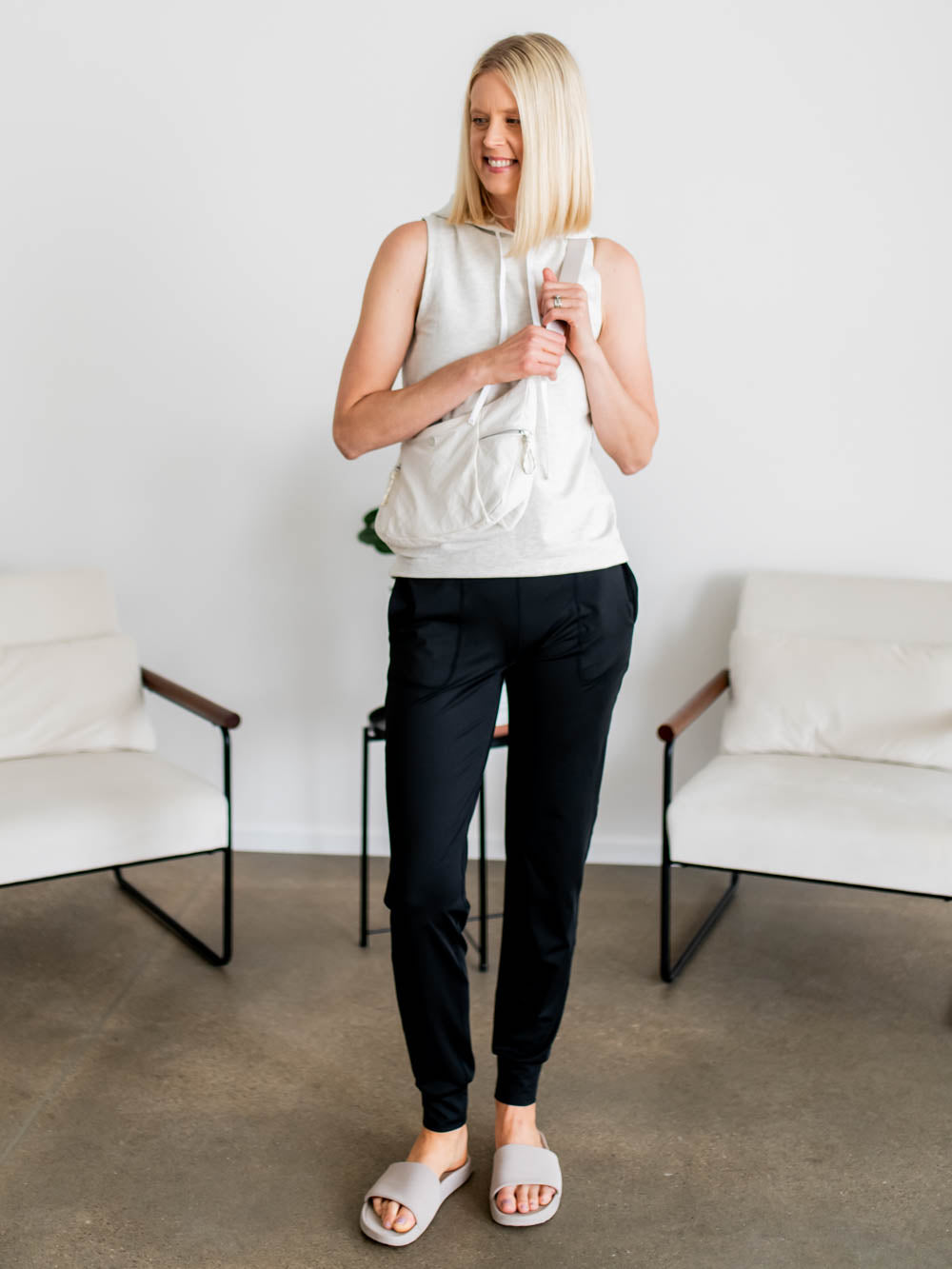 Tall woman wearing The Stride Jogger in black with wide waistband and relaxed fit