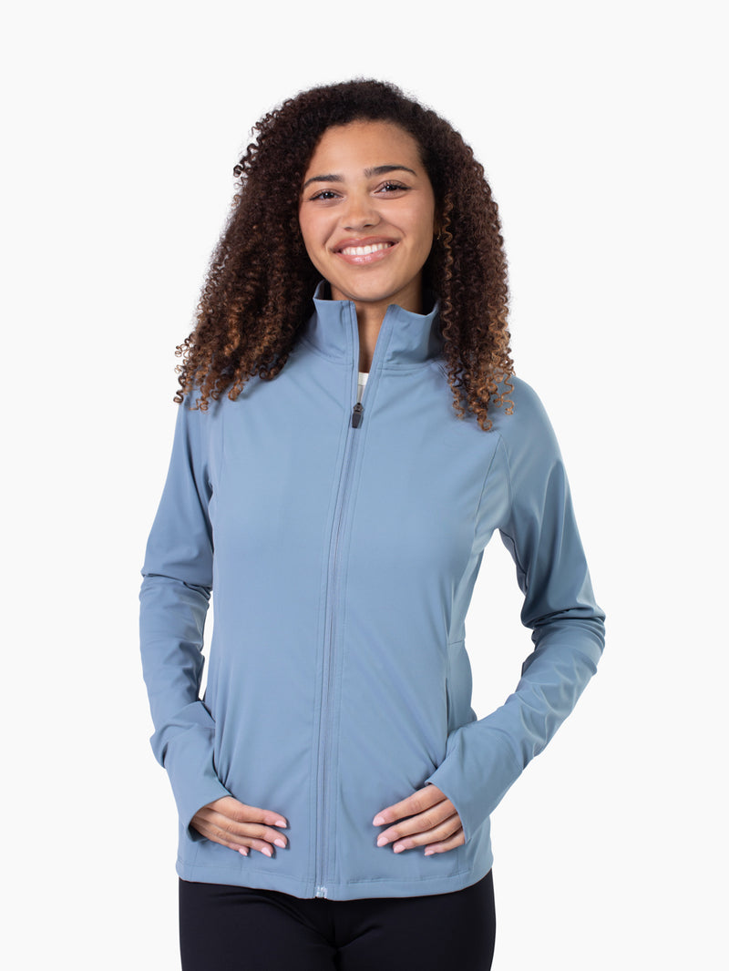 Tall woman wearing Studio Athletic Jacket in steel blue