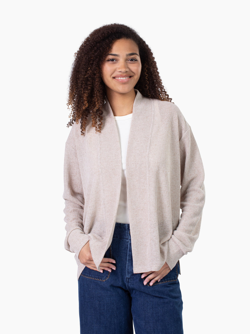 Tall woman wearing Cove Cardigan in sand