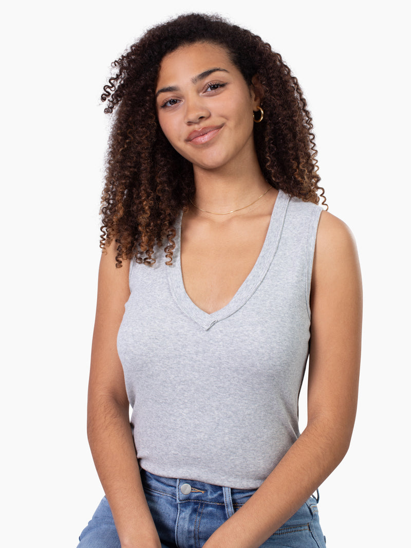 Tall woman wearing Riviera ribbed v-neck tank in light grey