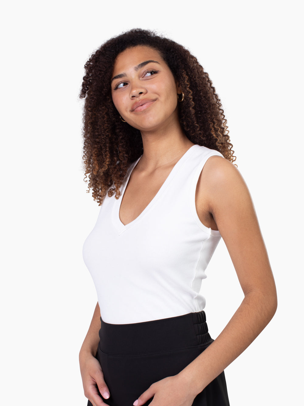 Tall woman wearing Riviera ribbed v-neck tank in white