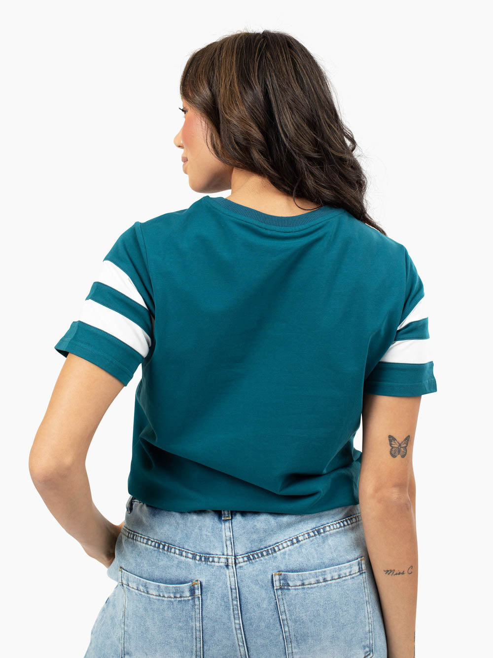 tall model wearing cotton stretch t-shirt and wide leg jeans