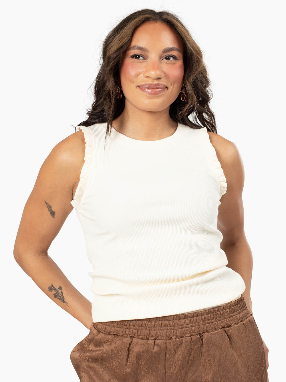 Chloe ecru ruffle tank styled with tall jeans front view