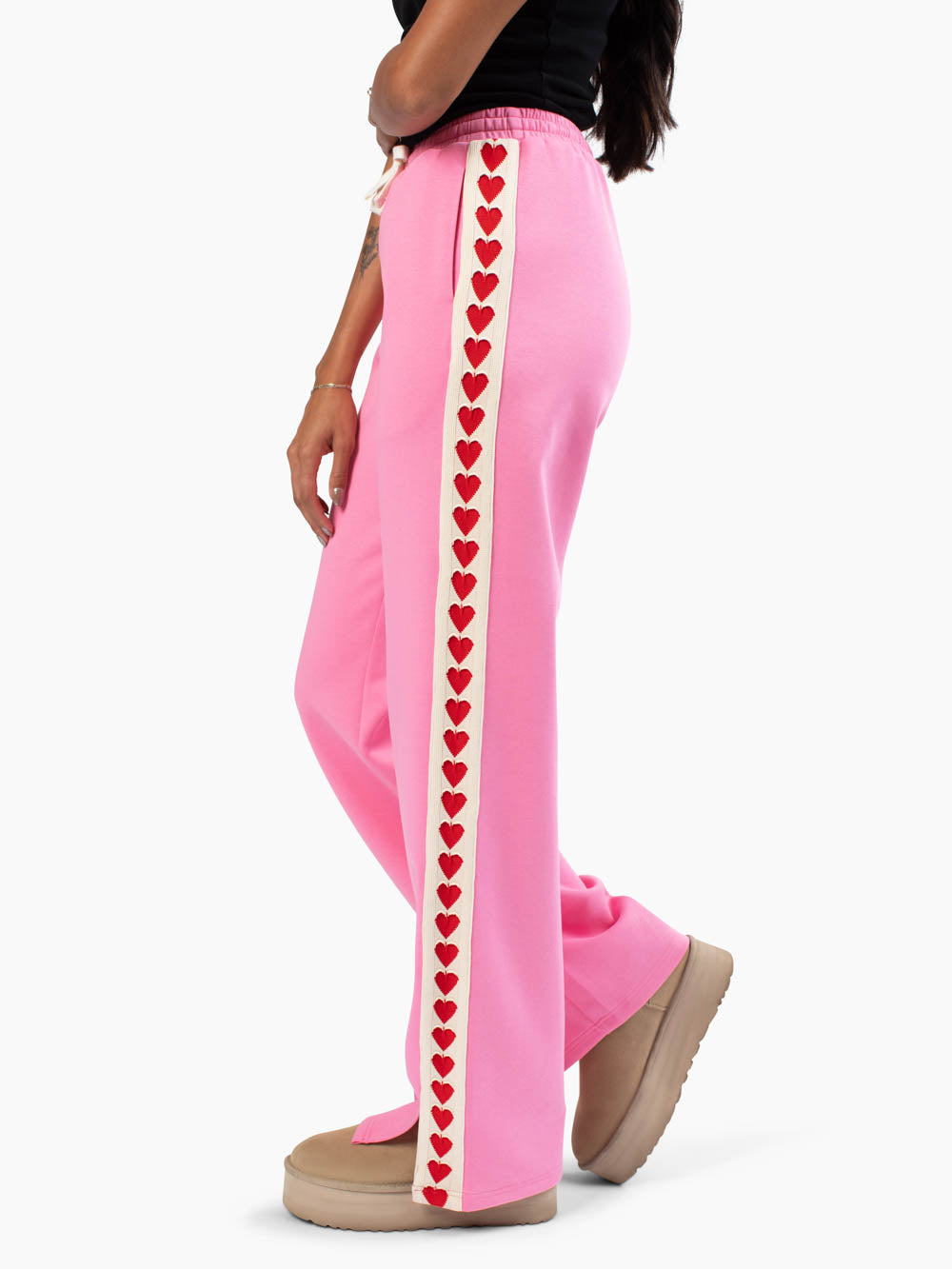 Side view of tall sweatpants with heart crochet detail