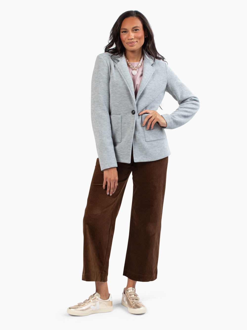 Tall woman wearing the Margo Knit Blazer in light grey
