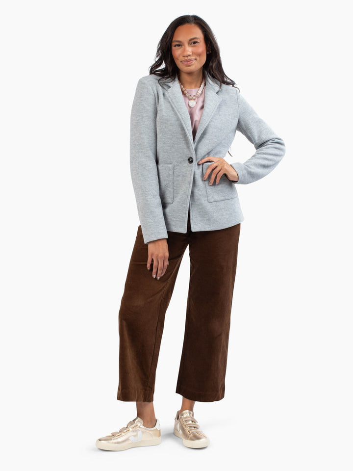 Tall woman wearing the Margo Knit Blazer in light grey
