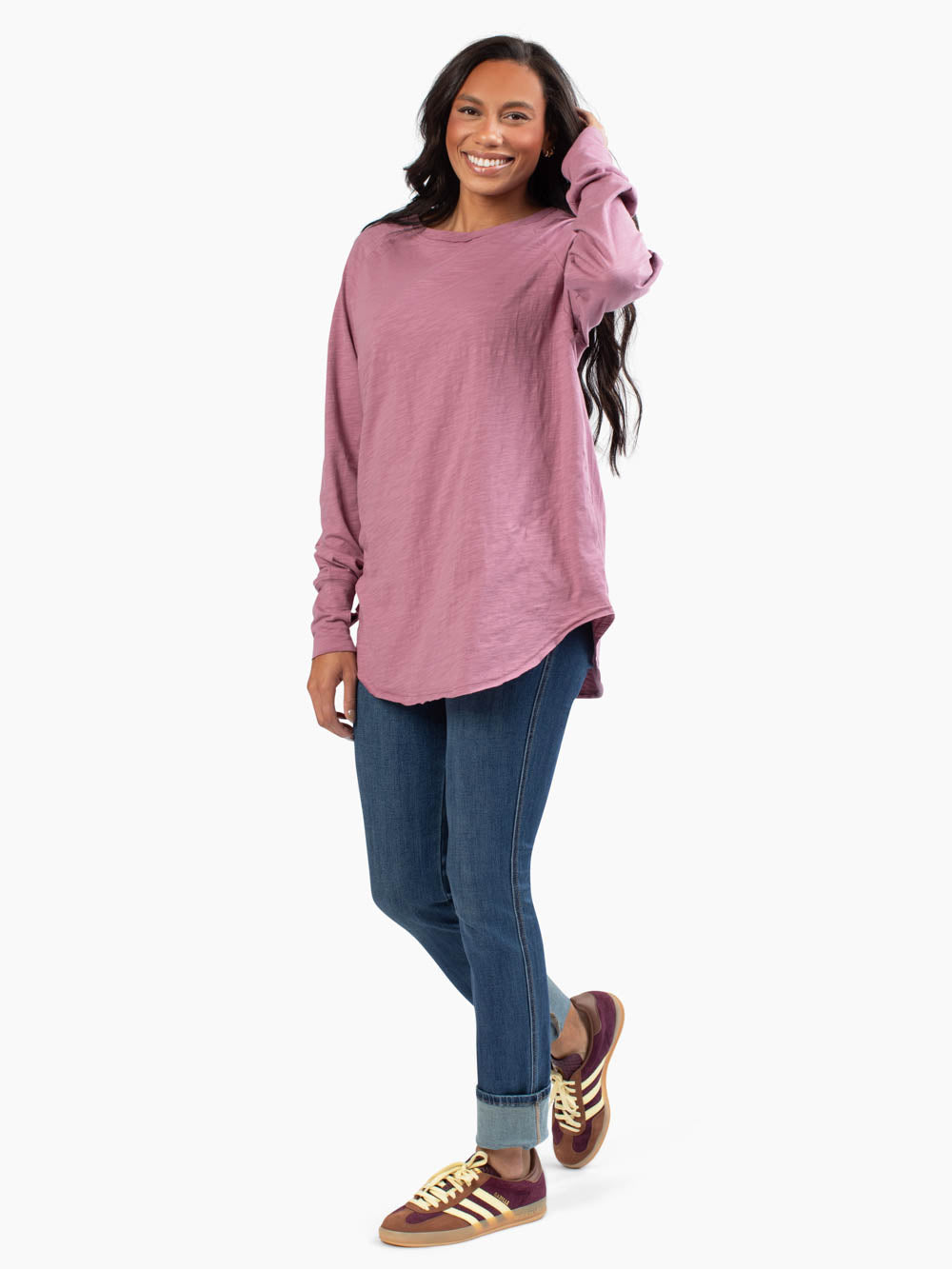 Front view of malley long sleeve tee untucked in mauve purple on tall model