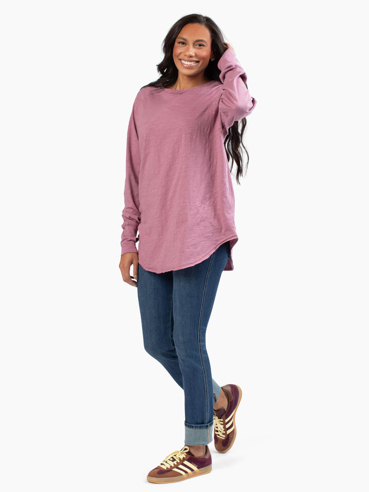 Front view of malley long sleeve tee untucked in mauve purple on tall model