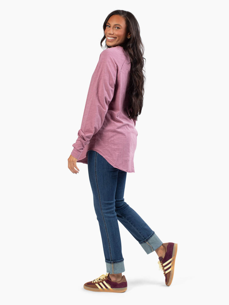 Side profile of tall model wearing mauve purple-colored malley long sleeve tee