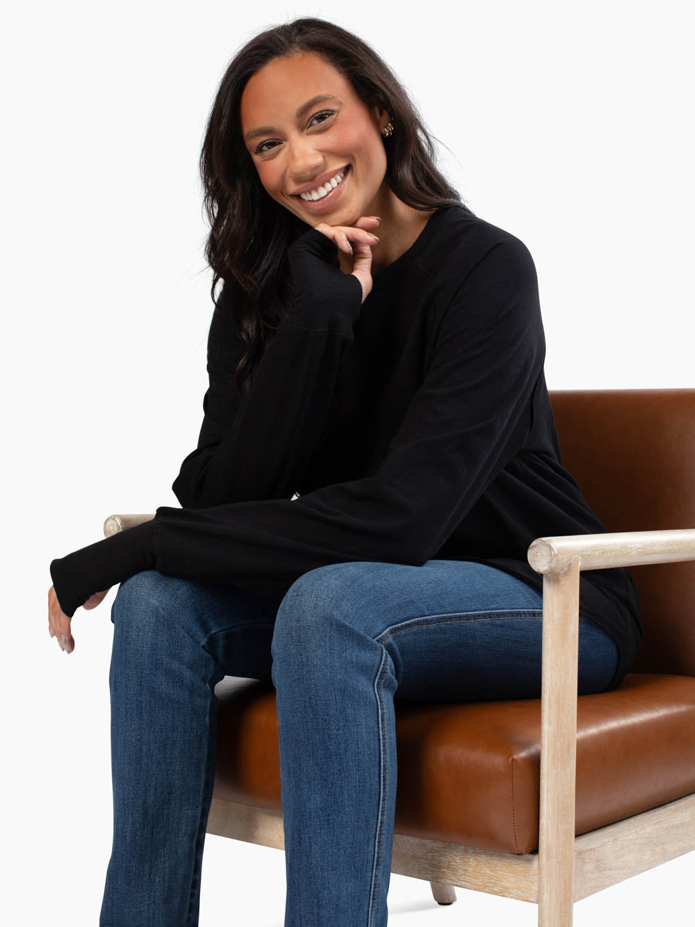 Tall woman wearing black malley long sleeve tee 