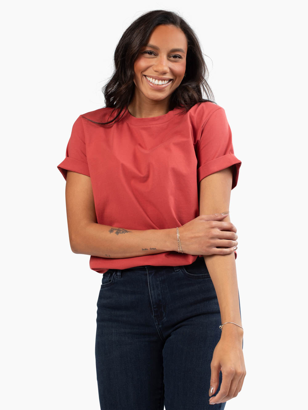 Tall woman wearing apple cider frame tee with cuffed sleeves and relaxed fit