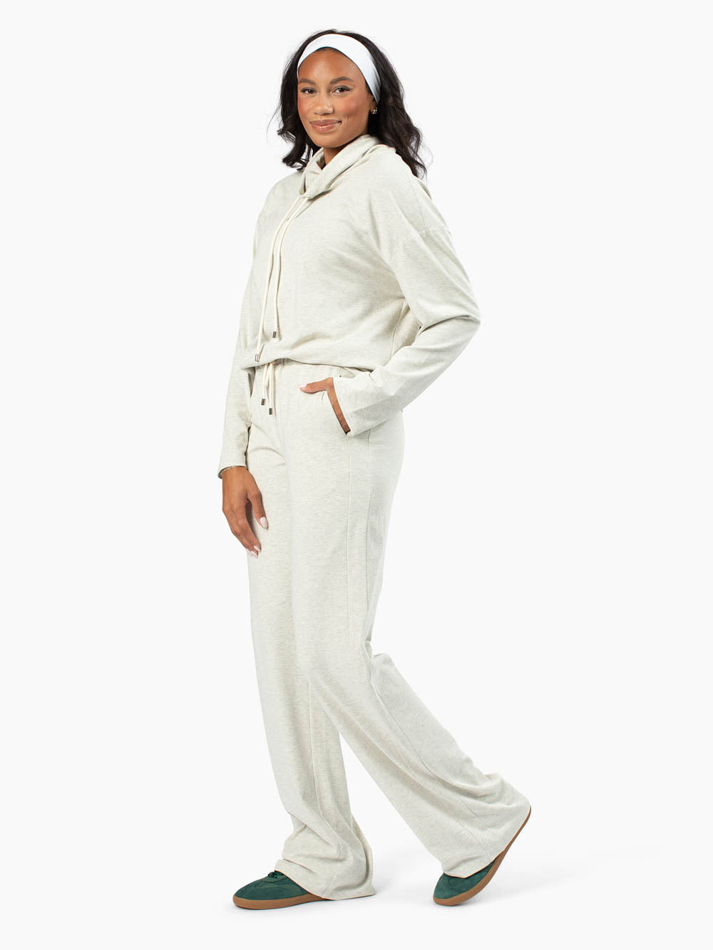 Tall woman wearing cozy funnel neck sweatshirt and matching pants