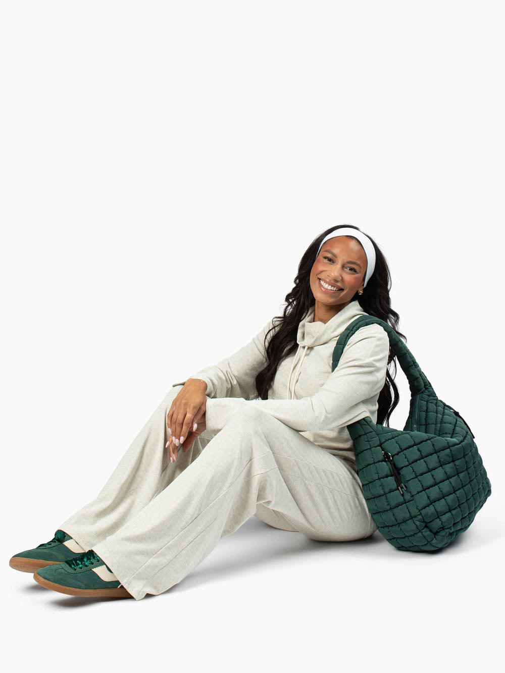 Tall lounge set in oatmeal heather fabric styled with slippers and tote bag