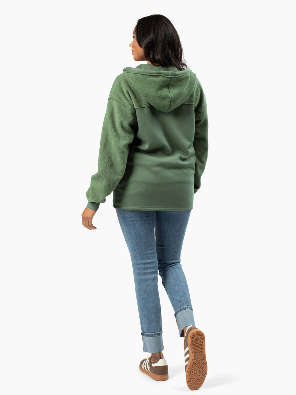 Oakley Hoodie in green styled casually with jeans on tall model
