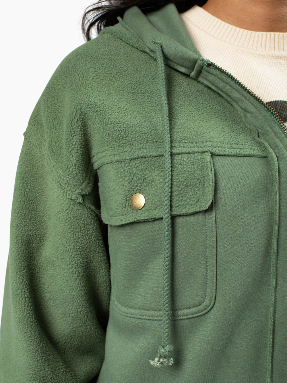 Front view showing flap pockets and zip-up design