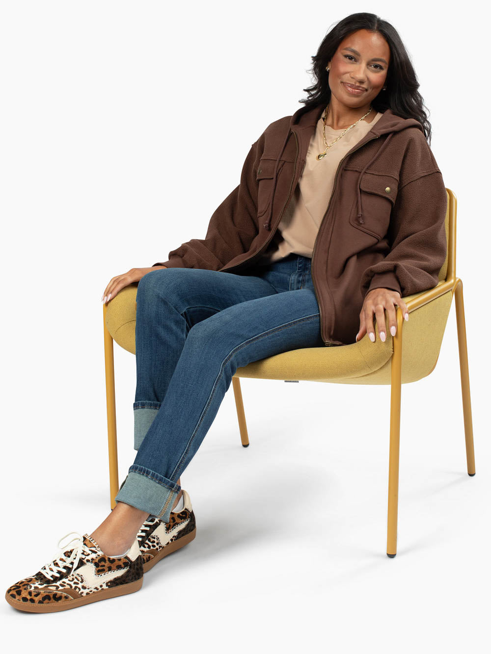 Oakley Hoodie in brown styled casually with jeans on tall model