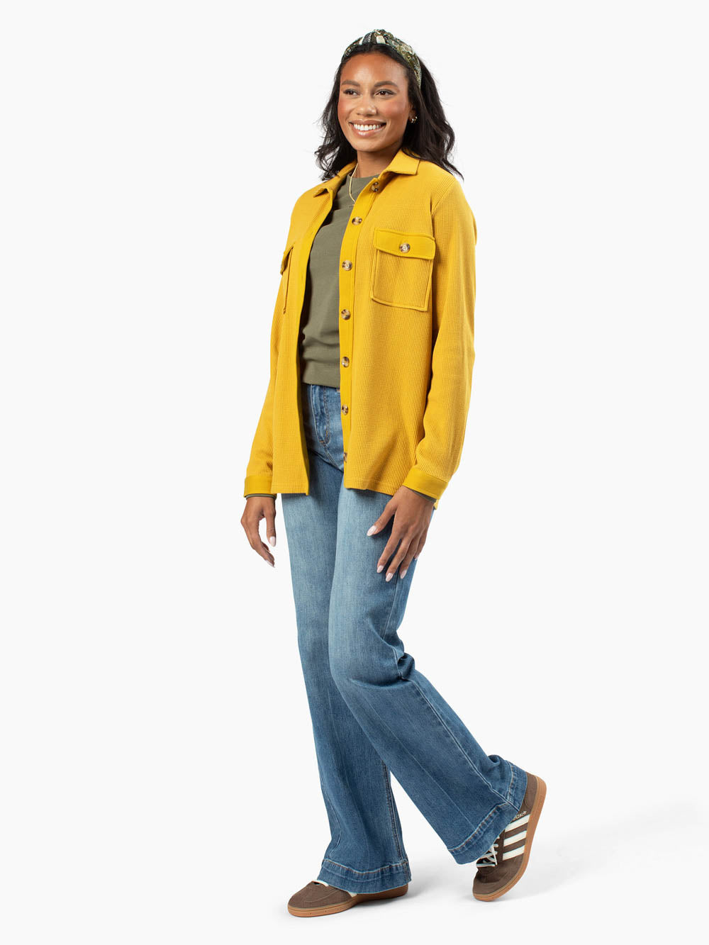 Tall woman wearing mustard waffle knit button-up shirt jacket