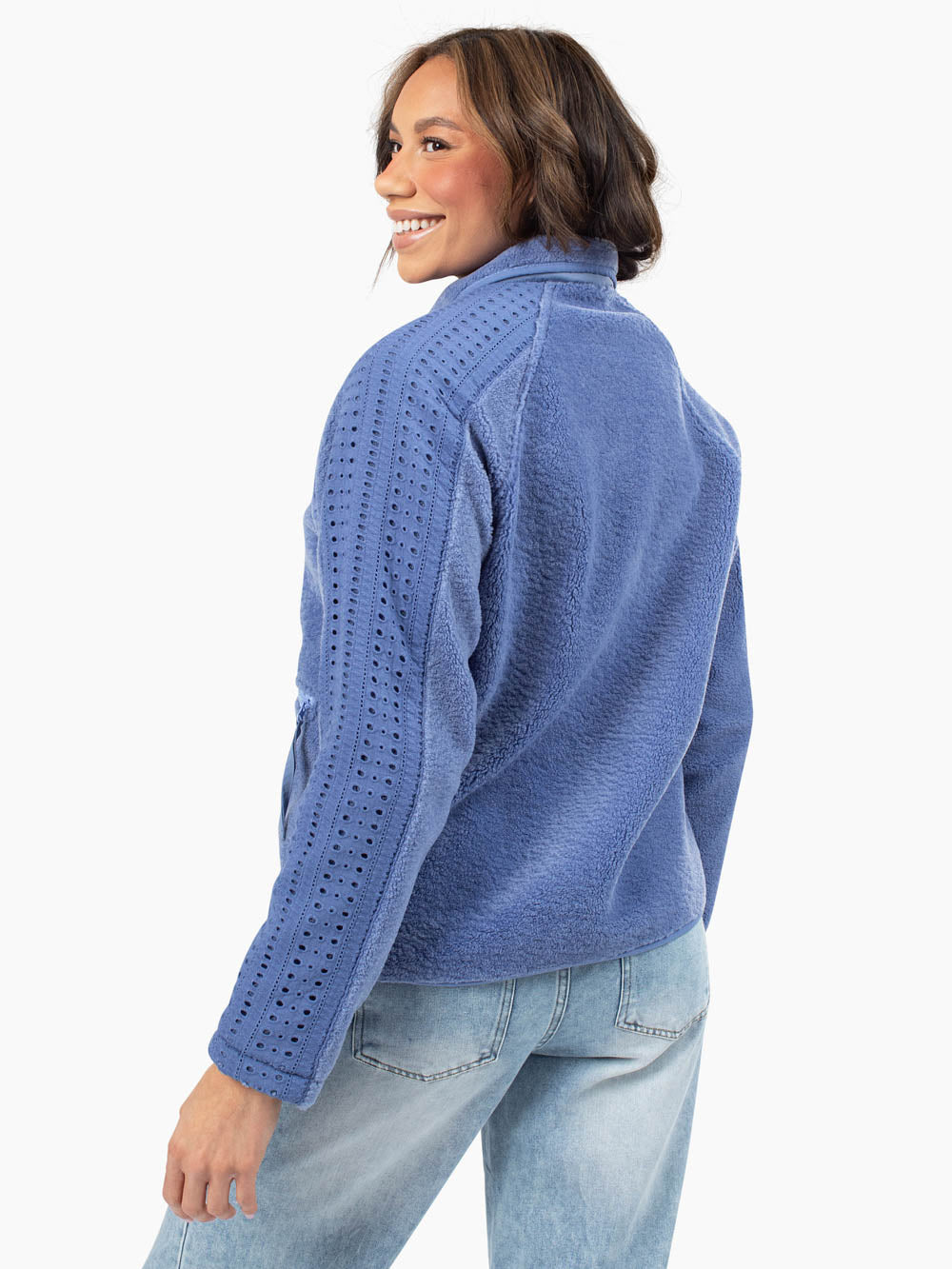 Tall model wearing Juniper eyelet fleece jacket styled with jeans