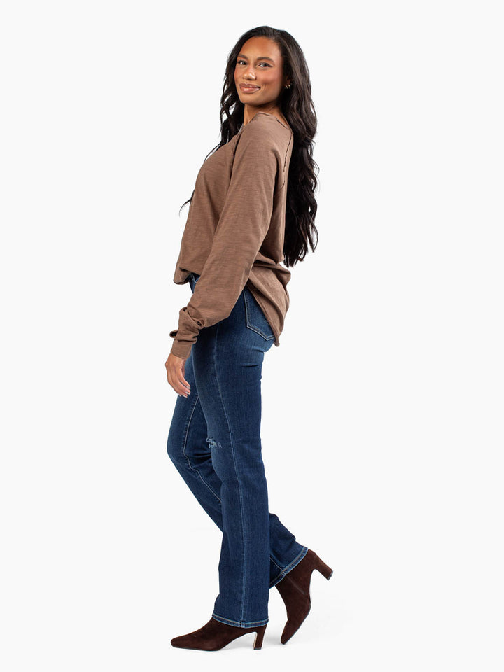 Side profile of tall model wearing brown-colored malley long sleeve tee