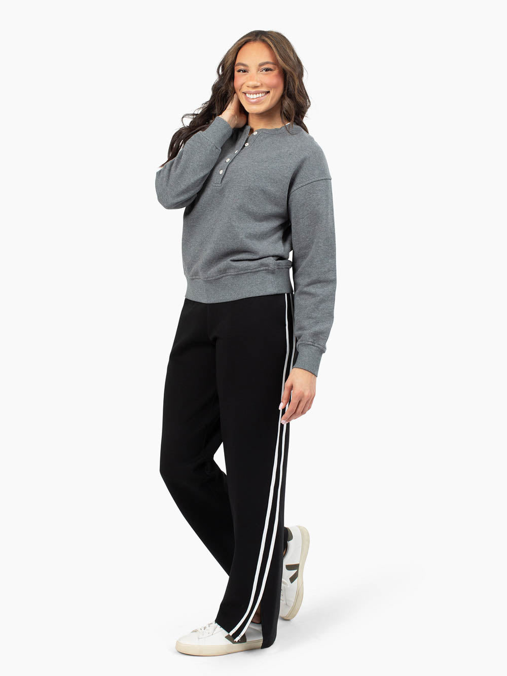 Tall woman wearing charcoal henley sweatshirt with lounge pants