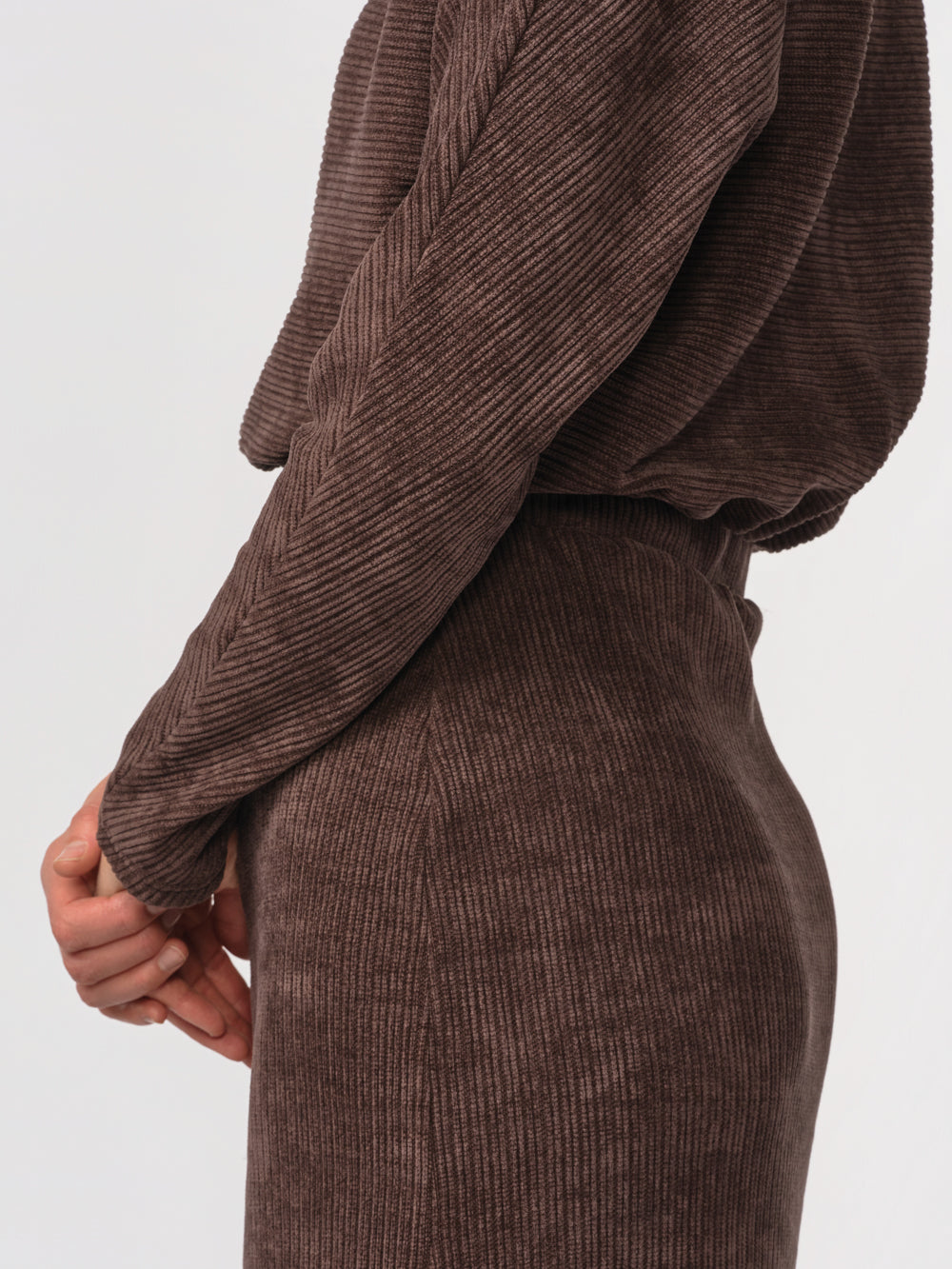 Close-up of the Annika dress's dolman sleeve and ribbed knit texture