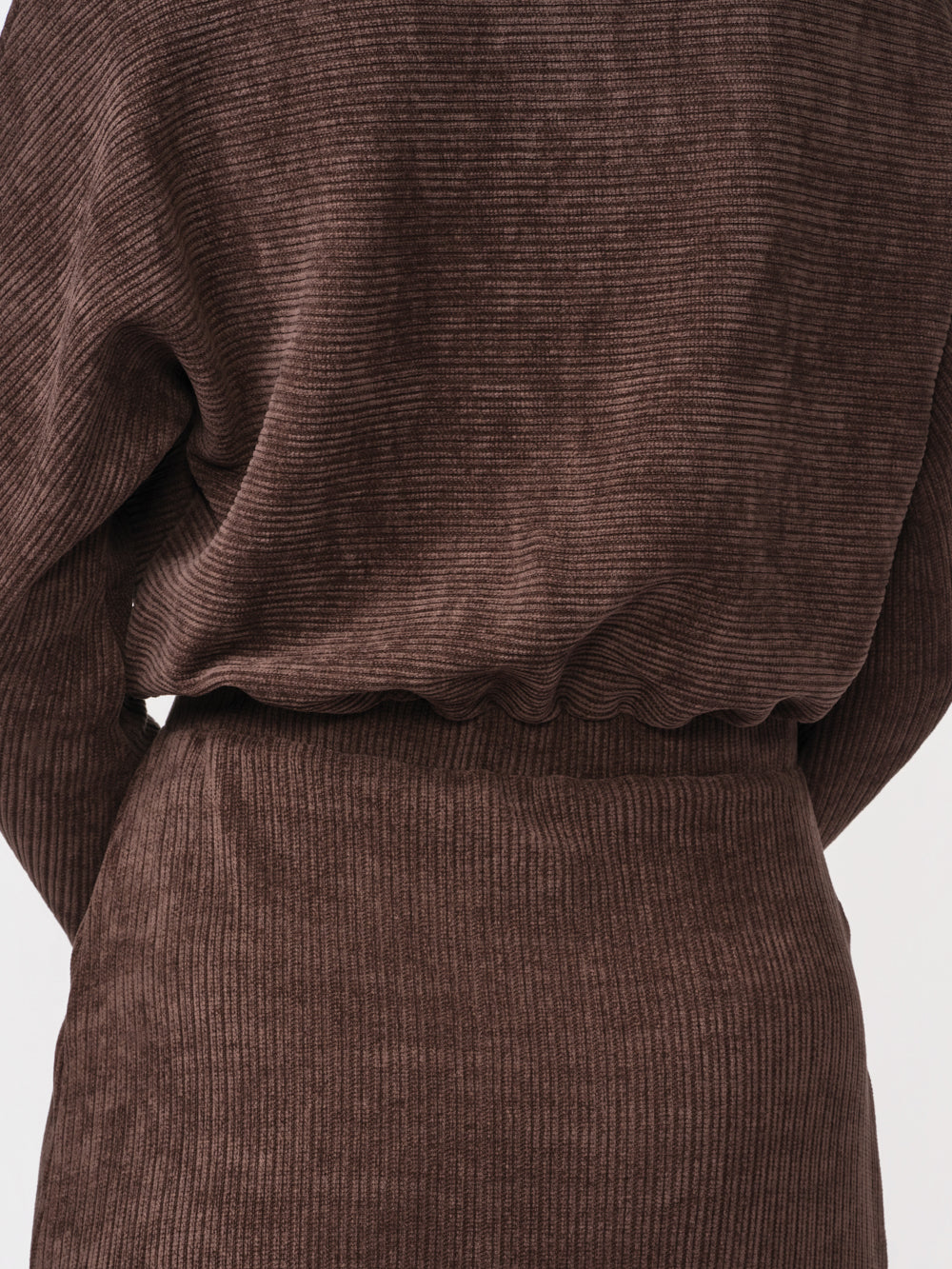 Back close-up of the waist and ribbed knit texture on the Annika midi dress