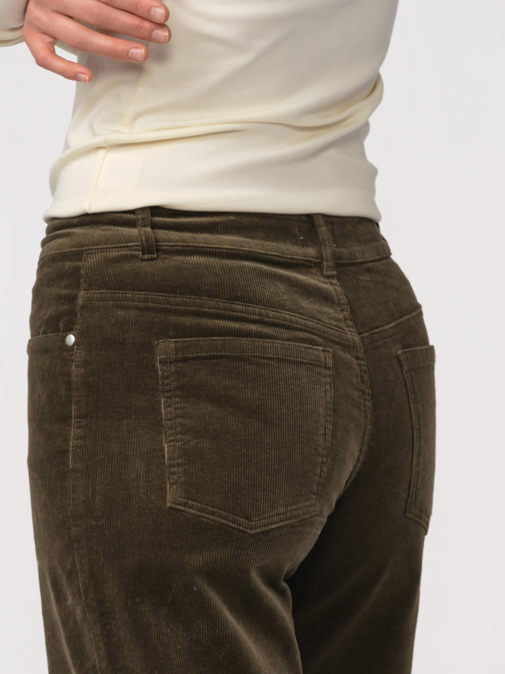 Close-up of the back pockets on the olive Daphne corduroy wide leg pant