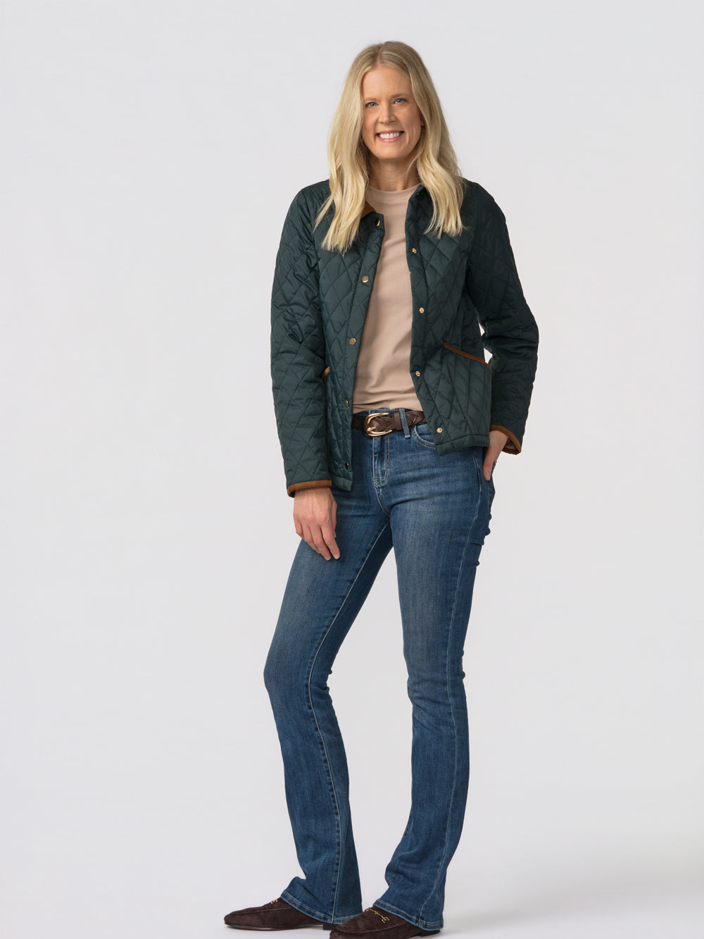 Langley quilted jacket for tall women in green, front view, worn open over a tan tee with bootcut jeans