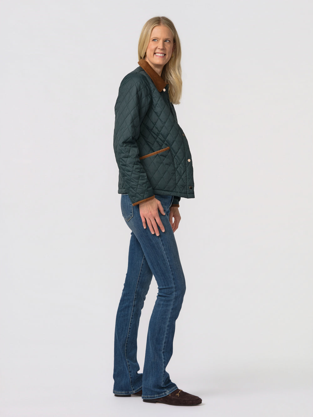 Side view of the green Langley quilted jacket for tall women showing the sleeve length