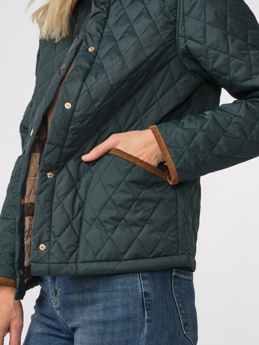 Close-up of the Langley quilted jacket's diamond quilting, patch pocket and cord trim
