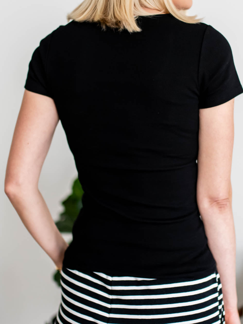 Back view of black ribbed short sleeve tee for tall women