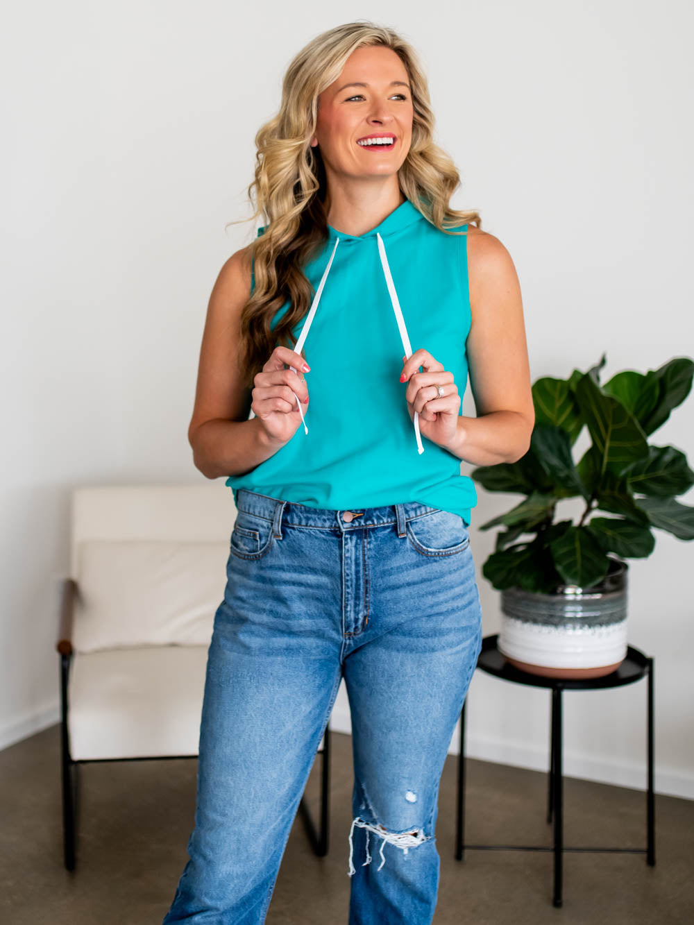 Relaxed fit Sideline Tank in caribbean blue styled with jeans on tall model 