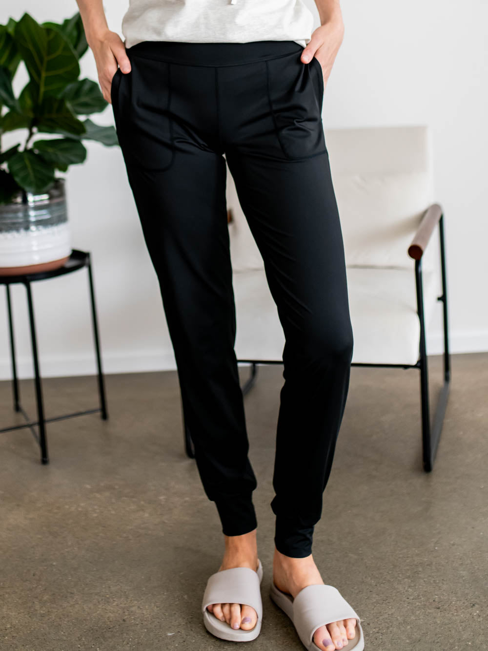 Front view of tall women’s joggers in black with 34-inch inseam and utility pockets