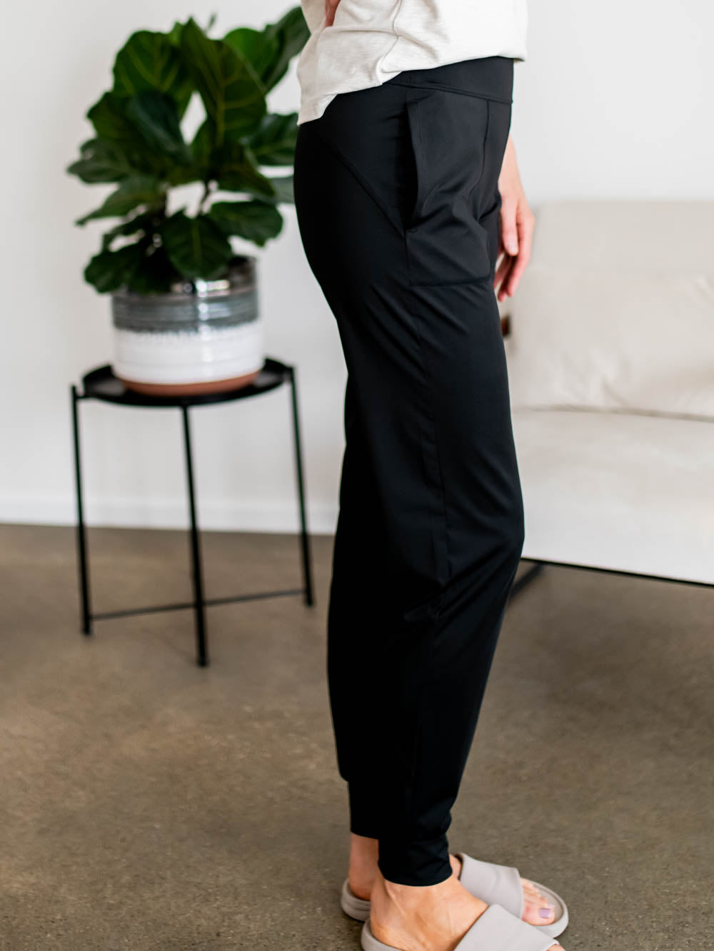 Side view of black athletic joggers for tall women in long inseam length