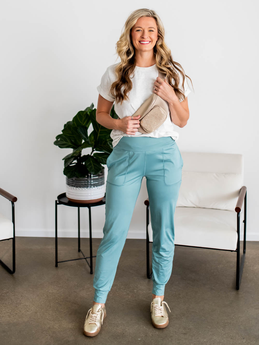 Tall woman wearing The Stride Jogger in eucalyptus with wide waistband and relaxed fit